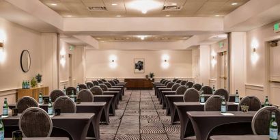 Royal Sonesta Portland Downtown meeting room, with tables arranged in a classroom format and seating for dozens of attendees.