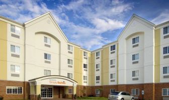 The hotel’s exterior has parking close to the front door, which features potted plants and has the Sonest Simply Suites name above it.