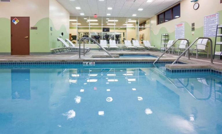 The indoor pool at Sonesta Milwaukee West Wauwatosa has an adjacent hot tub, sun loungers by the side, and is next to the fitness center.