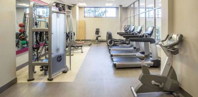 Sonesta Milwaukee West Wauwatosa’s fitness center is equipped with gym balls and various types of exercise machines.