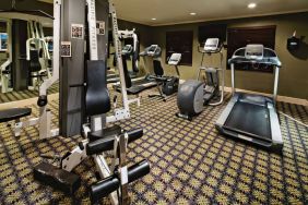 Sonesta ES Suites Dallas Las Colinas’ fitness center has a wall-mounted television and assorted exercise machines for guests to use.