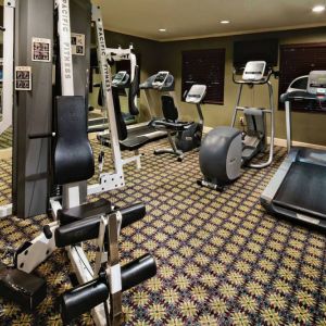 Sonesta ES Suites Dallas Las Colinas’ fitness center has a wall-mounted television and assorted exercise machines for guests to use.