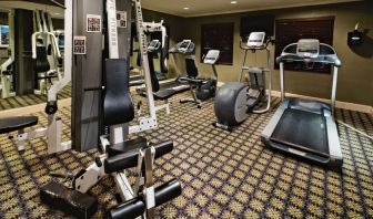 Sonesta ES Suites Dallas Las Colinas’ fitness center has a wall-mounted television and assorted exercise machines for guests to use.