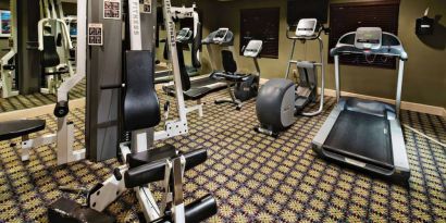 Sonesta ES Suites Dallas Las Colinas’ fitness center has a wall-mounted television and assorted exercise machines for guests to use.