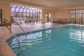 Sonesta Select Columbia’s indoor pool has large windows for plenty of light, and both loungers and chairs by the side.