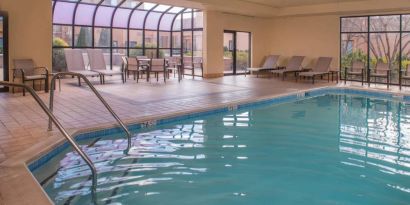 Sonesta Select Columbia’s indoor pool has large windows for plenty of light, and both loungers and chairs by the side.