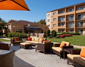 The hotel’s patio has armchairs and sofas, with coffee tables, as well as shaded tables and chairs.