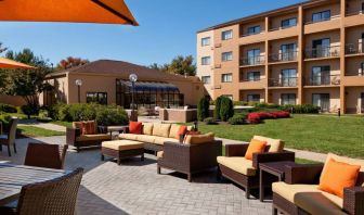 The hotel’s patio has armchairs and sofas, with coffee tables, as well as shaded tables and chairs.