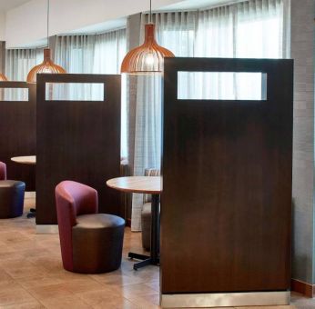 The hotel’s media pods are cozy nooks for socializing or co-working, with comfy seats and coffee tables by the windows.