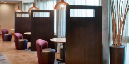 The hotel’s media pods are cozy nooks for socializing or co-working, with comfy seats and coffee tables by the windows.