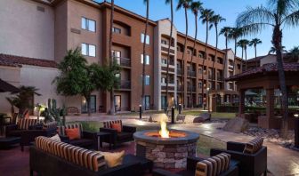 Sonesta Select Phoenix Camelback’s patio features a fire pit surrounded by armchair and sofa seating.