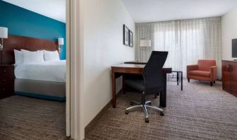 Sonesta ES Suites Dallas Medical Market Center double bed guest room, including a workspace desk and chair.