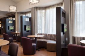 The hotel’s media pods are each furnished with a coffee table, TV, and comfortable seating.