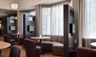 The hotel’s media pods are each furnished with a coffee table, TV, and comfortable seating.