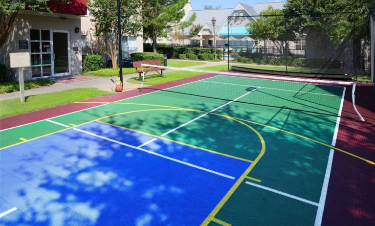 The hotel’s sports court is suitable for multiple activities including basketball and tennis, and has a bench for spectators.