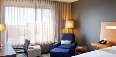 Delux king room with natural light at Novotel Toronto Vaughan Centre.