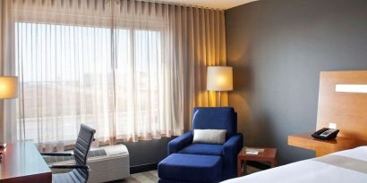 Delux king room with natural light at Novotel Toronto Vaughan Centre.