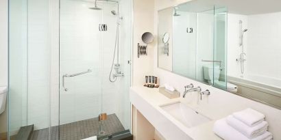 Guest bathroom with showerr at Novotel Toronto Vaughan Centre.