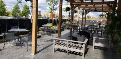 Outdoor lounge and dining space at Novotel Toronto Vaughan Centre.