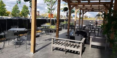 Outdoor lounge and dining space at Novotel Toronto Vaughan Centre.