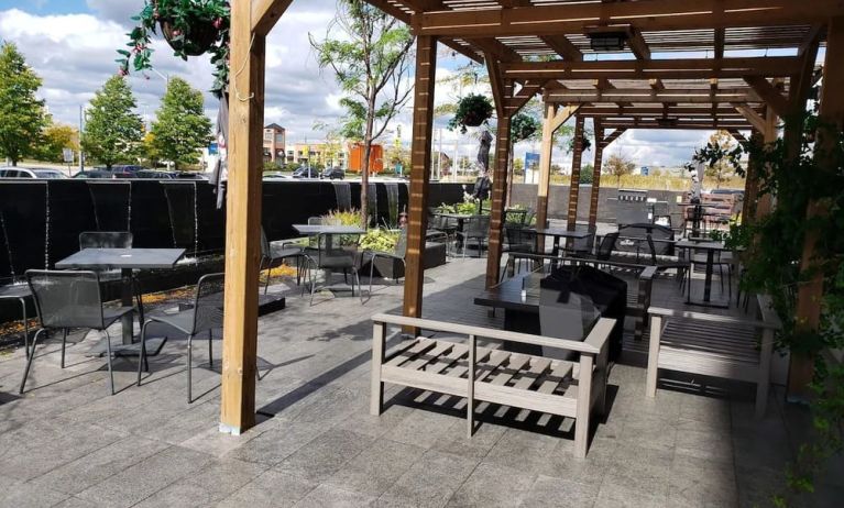 Outdoor lounge and dining space at Novotel Toronto Vaughan Centre.