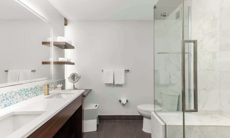 Private guest bathroom with shower at The Art Hotel Denver.