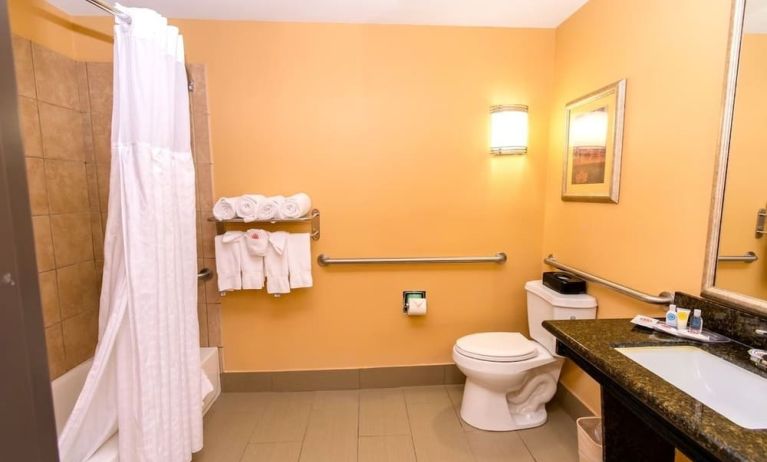 Guest bathroom with shower at Hotel Pearland.