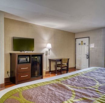 Day use room with TV and mini-fridge at Super 8 By Wyndham Houston/Webster.