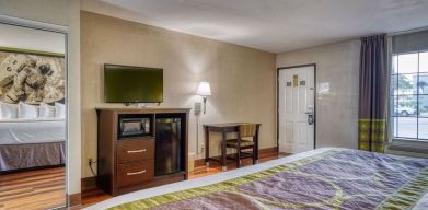 Day use room with TV and mini-fridge at Super 8 By Wyndham Houston/Webster.