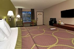 Day room with TV, microwave, and mini-fridge at Super 8 By Wyndham Houston/Webster.