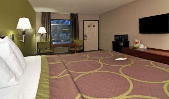 Day room with TV, microwave, and mini-fridge at Super 8 By Wyndham Houston/Webster.