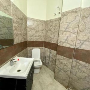 Guest bathroom with shower at Pradhan Stay Sohna Near Bus Stand.