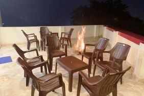 Lounge and coworking space with fire at Pradhan Stay Sohna Near Bus Stand.