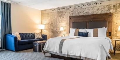 King bed with natural light at EnVision Hotel St. Paul South.