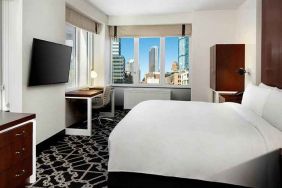 King bed with TV and natural light at Hilton Brooklyn New York.