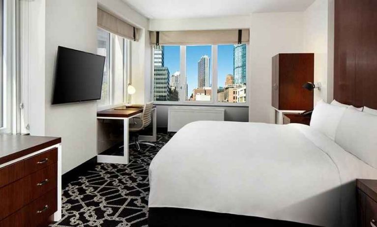 King bed with TV and natural light at Hilton Brooklyn New York.