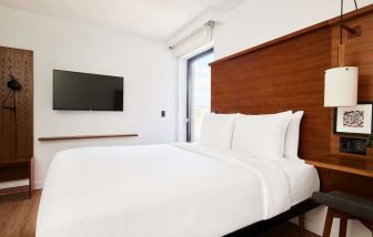 King bed with TV at Arlo SoHo.