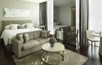 Spacious king room with lounge at Fraser Residence Menteng Jakarta.