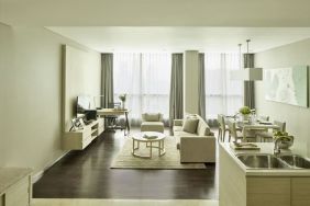 Spacious day room with kitchen and lounge at Fraser Residence Menteng Jakarta.