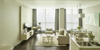 Spacious day room with kitchen and lounge at Fraser Residence Menteng Jakarta.