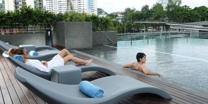 Stunning outdoor pool with lounge chairs at Capri By Fraser Johor Bahru.