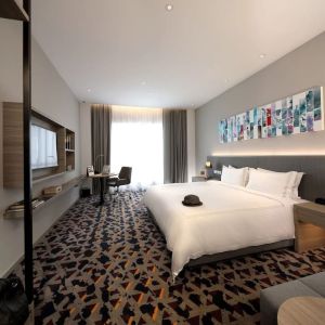 Delux king room with TV and natural light at Capri By Fraser Johor Bahru.