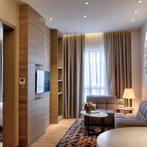 King room with lounge area at Capri By Fraser Johor Bahru.