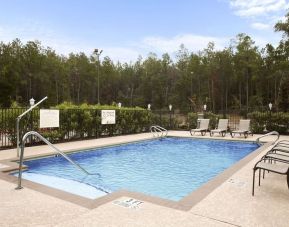 Relaxing outdoor pool at Hampton Inn & Suites Conroe - I-45 North.