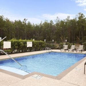 Relaxing outdoor pool at Hampton Inn & Suites Conroe - I-45 North.