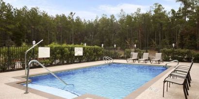 Relaxing outdoor pool at Hampton Inn & Suites Conroe - I-45 North.