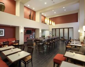 Coworking space and dining area at Hampton Inn & Suites Conroe - I-45 North.