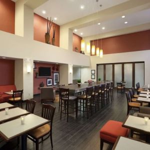 Coworking space and dining area at Hampton Inn & Suites Conroe - I-45 North.