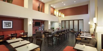 Coworking space and dining area at Hampton Inn & Suites Conroe - I-45 North.