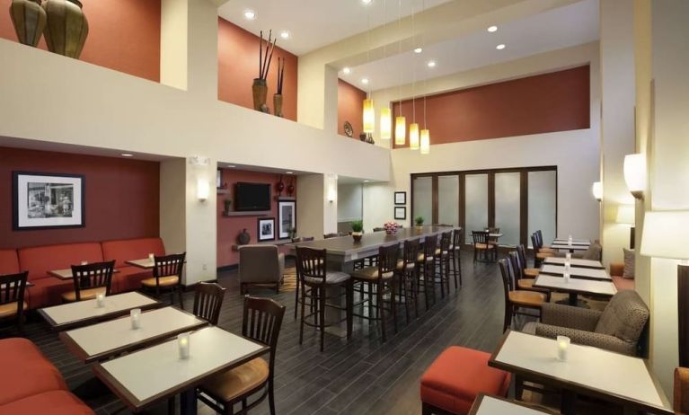 Coworking space and dining area at Hampton Inn & Suites Conroe - I-45 North.